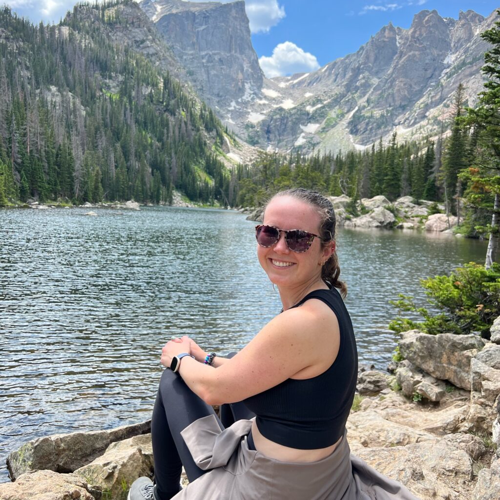 Dietitian Olivia Laughman standing in front of a lake