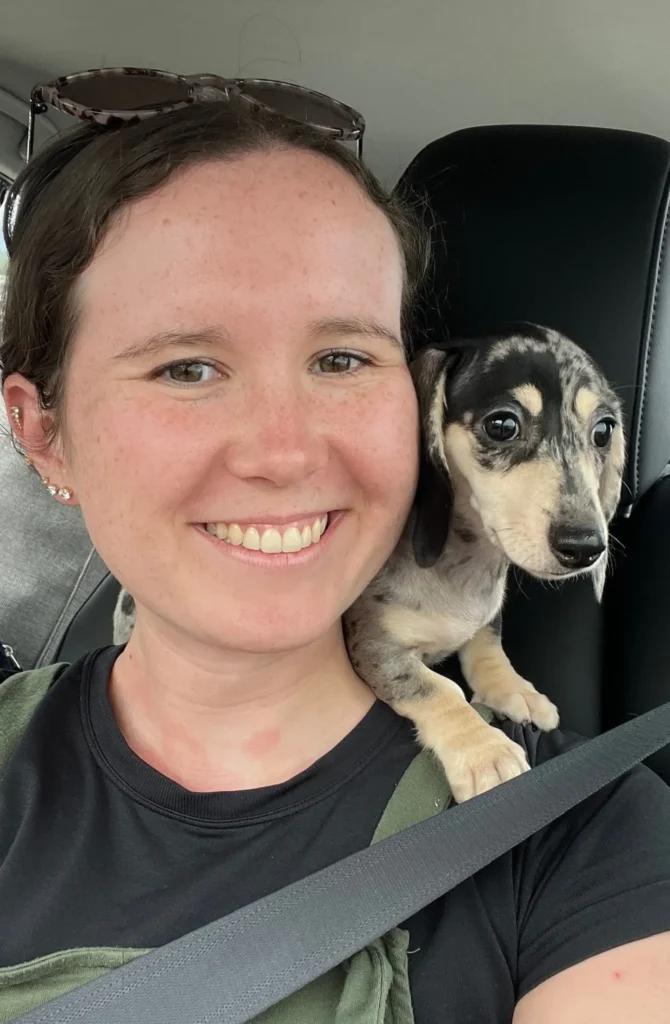 Food freedom dietitian posing with her dog luna on her shoulders
