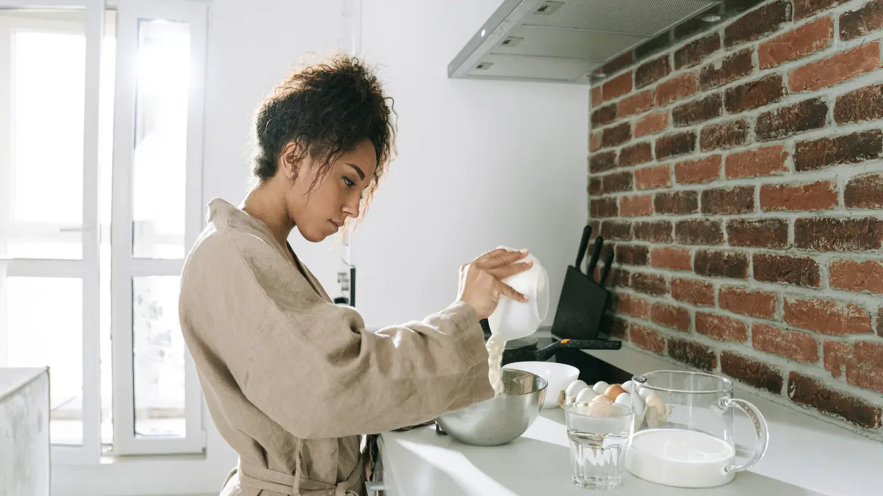 A women in the kitchen struggling with food noise